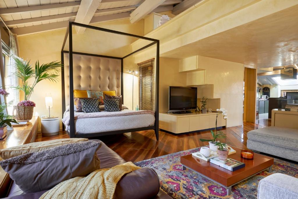 Televízia a/alebo spoločenská miestnosť v ubytovaní Residenza Elisabetta Luxury