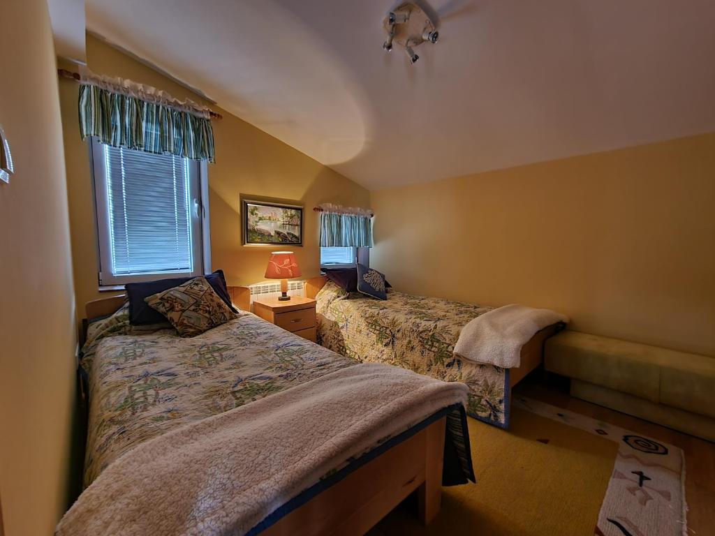 Katil atau katil-katil dalam bilik di Villa Diana Apartments