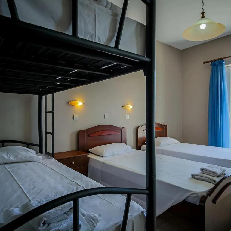 Postel nebo postele na pokoji v ubytování Perkes Hotel Complex