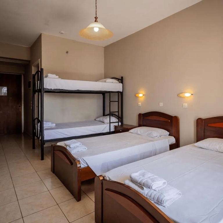 Postel nebo postele na pokoji v ubytování Perkes Hotel Complex
