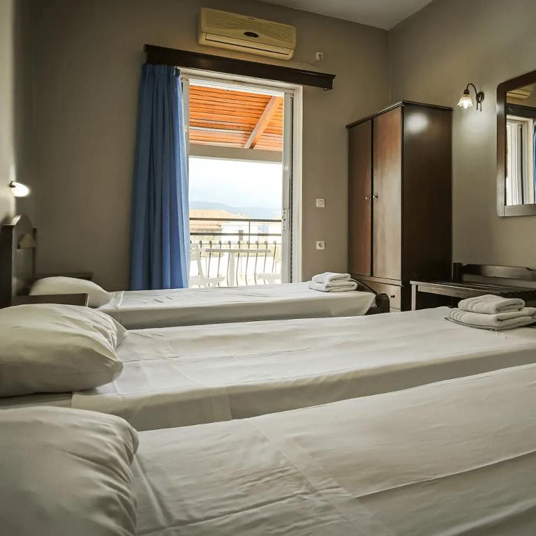 Postel nebo postele na pokoji v ubytování Perkes Hotel Complex