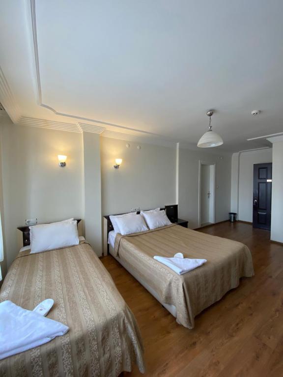 Postel nebo postele na pokoji v ubytování OTEL KING