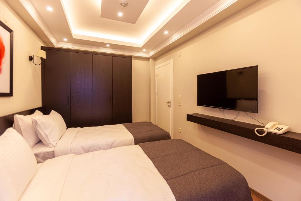 TV a/nebo společenská místnost v ubytování Lilium Luxury Suites