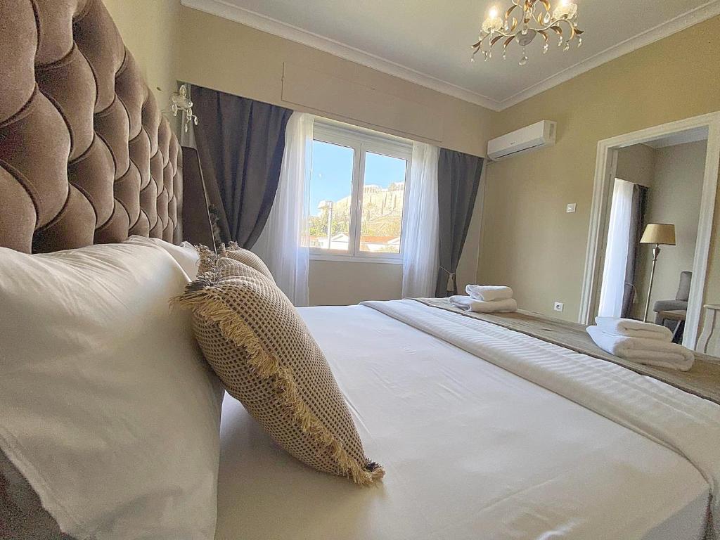Letto o letti in una camera di Check Point - Acropolis View