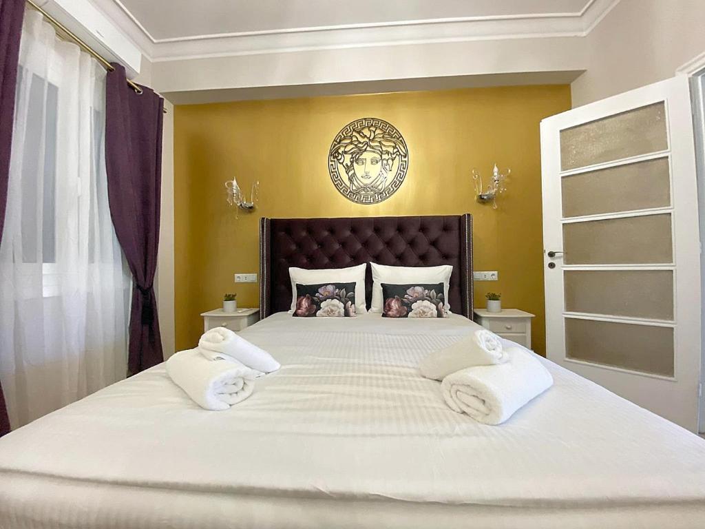 Letto o letti in una camera di Check Point - Acropolis View