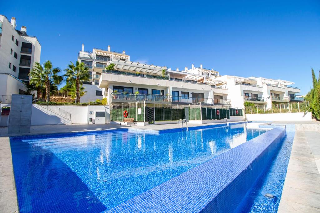 a large swimming pool in front of a building at 3082 Res LOMAS DE CAMPOAMOR in Orihuela Costa