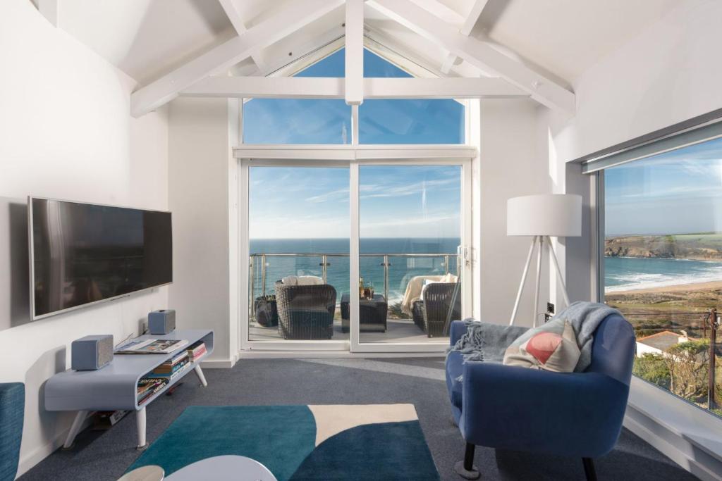 a living room with a view of the ocean at Blue Yonder, Praa Sands in Praa Sands