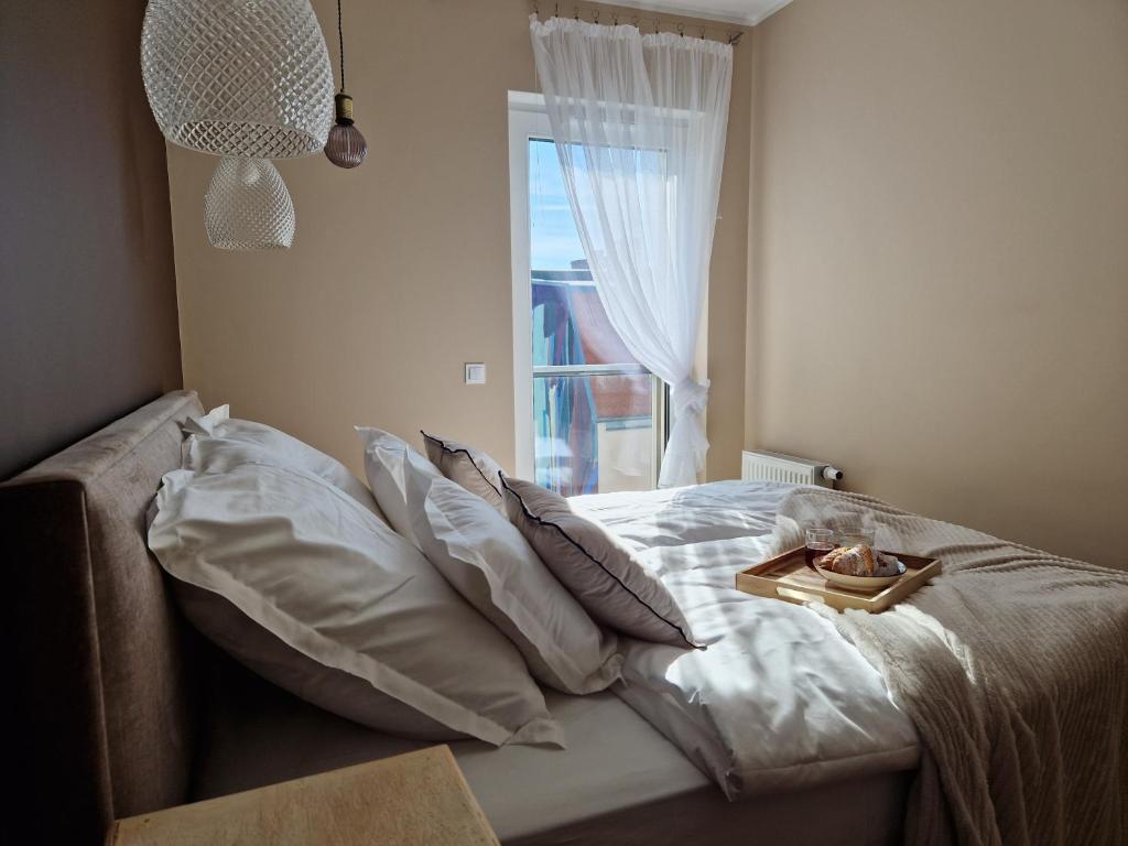Posteľ alebo postele v izbe v ubytovaní Apartament My City