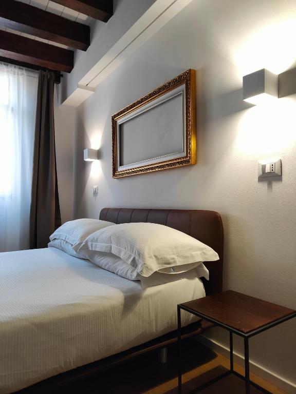 Postel nebo postele na pokoji v ubytování Borgo di Ponte Holiday Apartments & Rooms