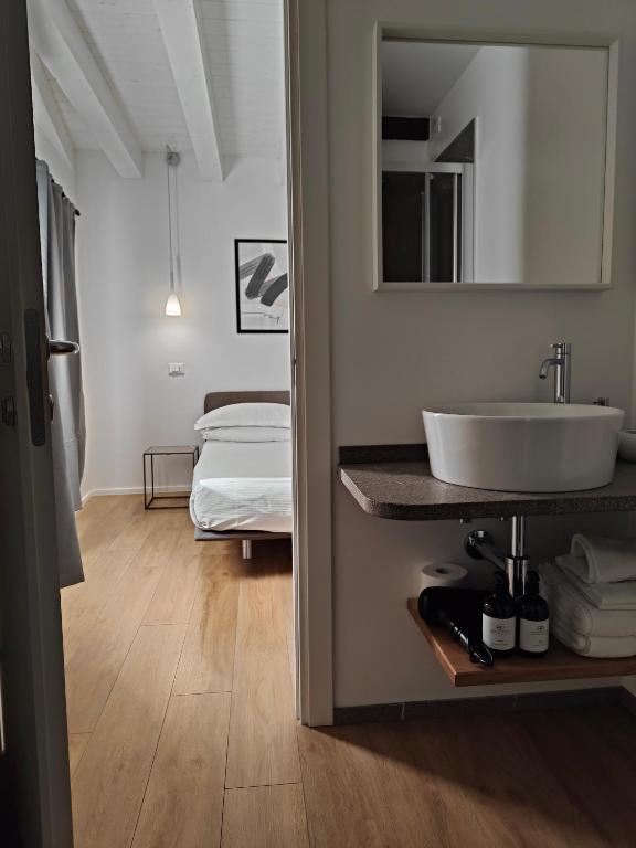 Postel nebo postele na pokoji v ubytování Borgo di Ponte Holiday Apartments & Rooms