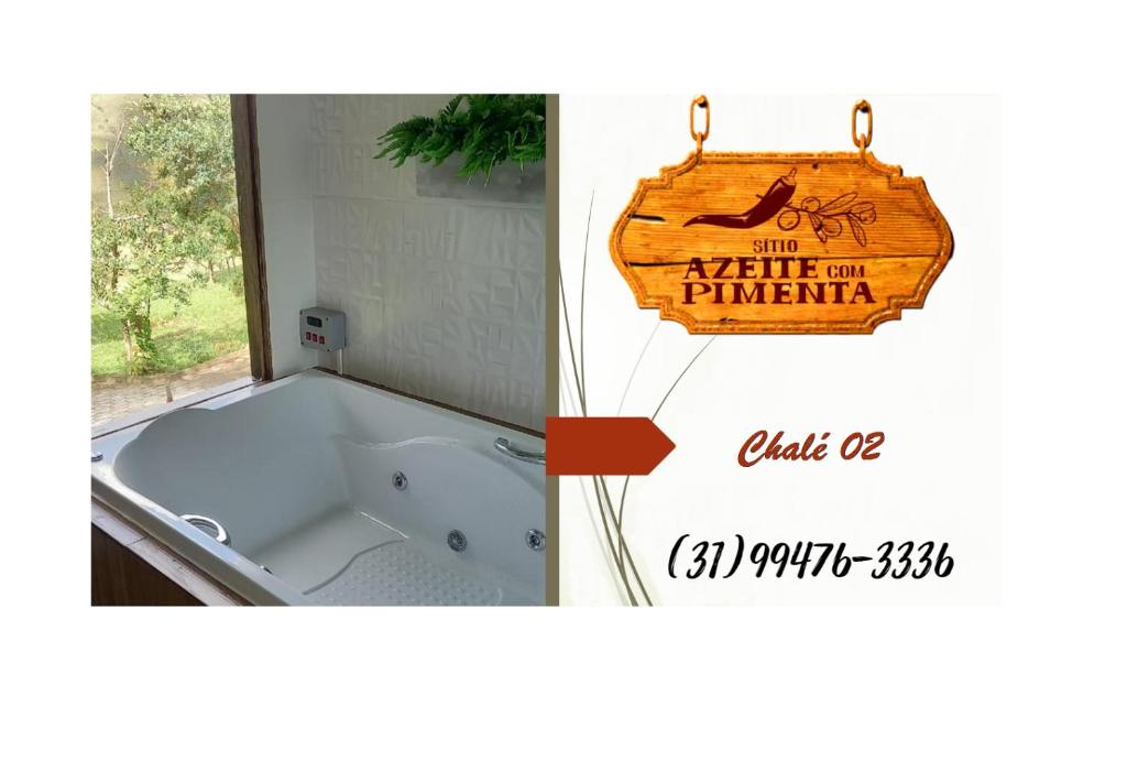a bath tub in a bathroom with a sign at Sitio Azeite com Pimenta in Itabirito