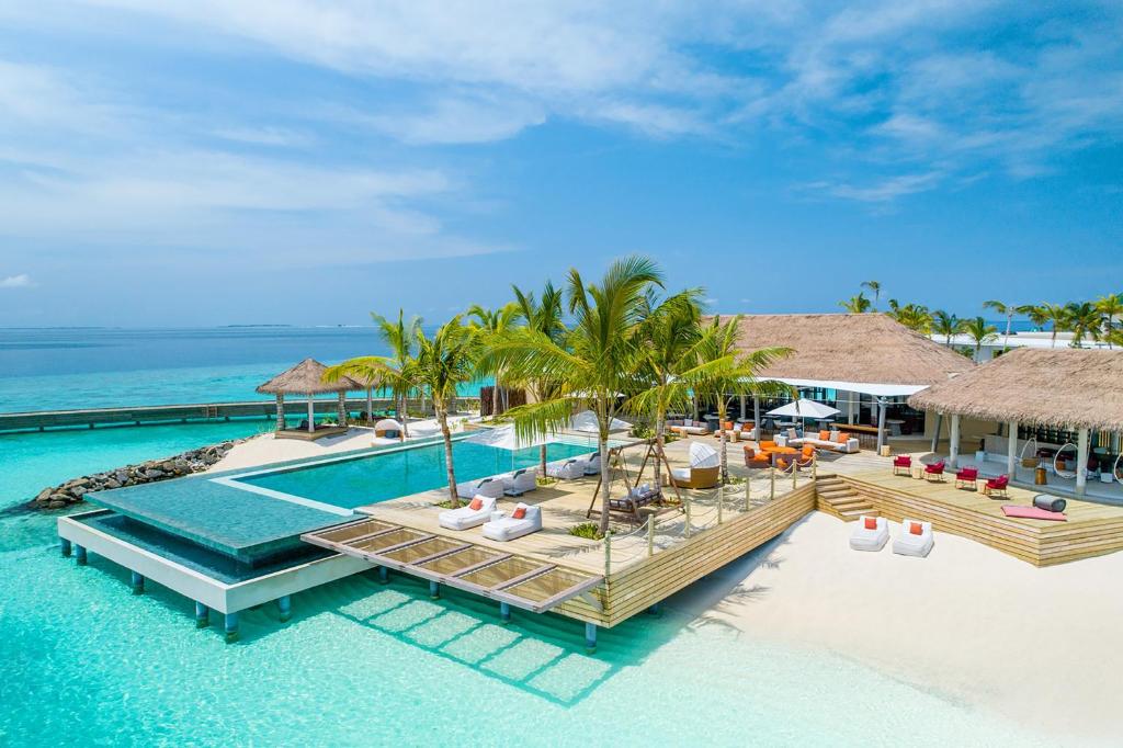 an aerial view of a resort with a swimming pool at Intercontinental Maldives Maamunagau Resort with Club benefits - IHG Hotel in Raa Atoll