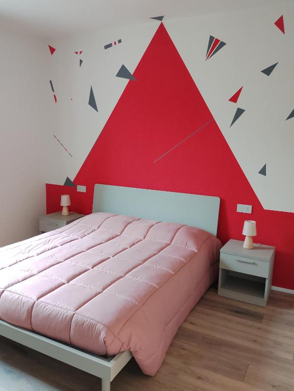Postel nebo postele na pokoji v ubytování B&B LA VALLUNA