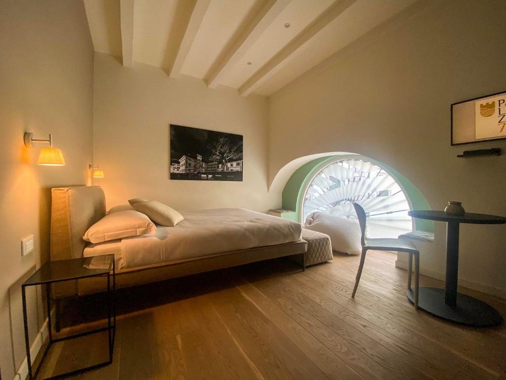 En eller flere senge i et værelse på Palazzo 7