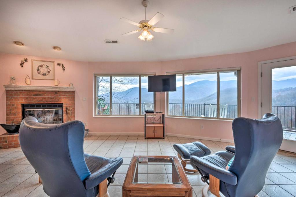 a living room with two chairs and a fireplace at Relax Fireside! Burnsville Apt 24 Mi to Ski Resort in Burnsville