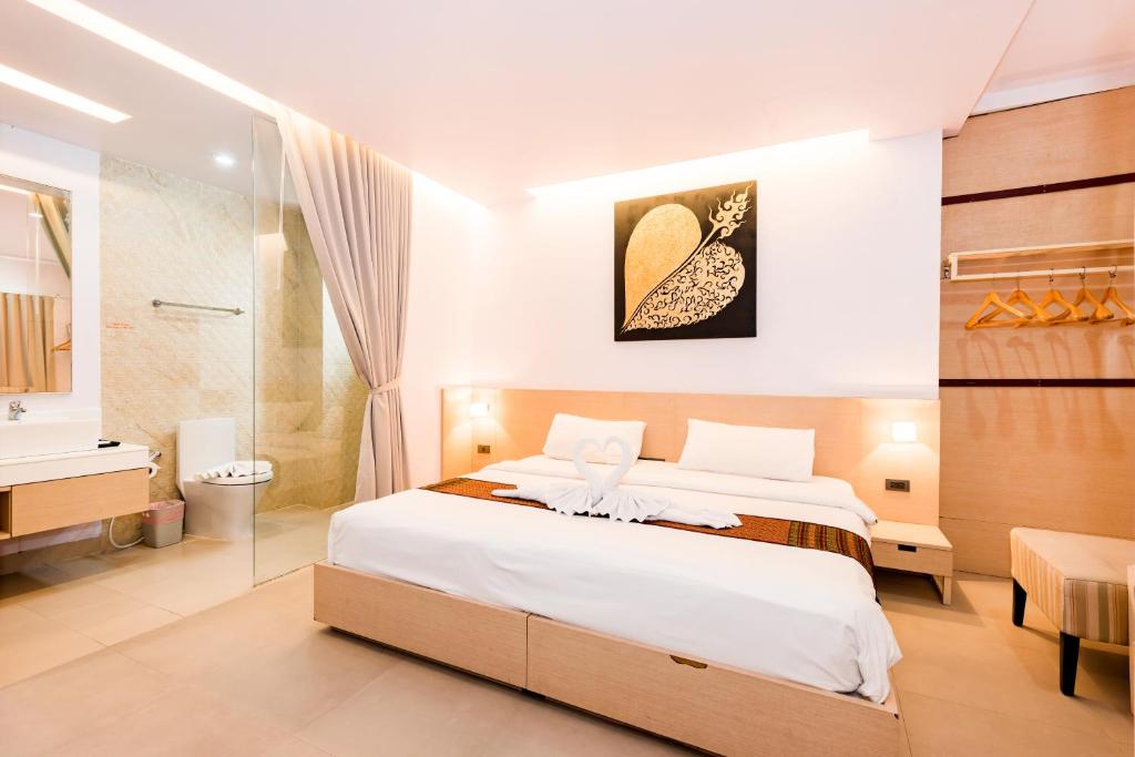 Postel nebo postele na pokoji v ubytování My Hotel Phuket