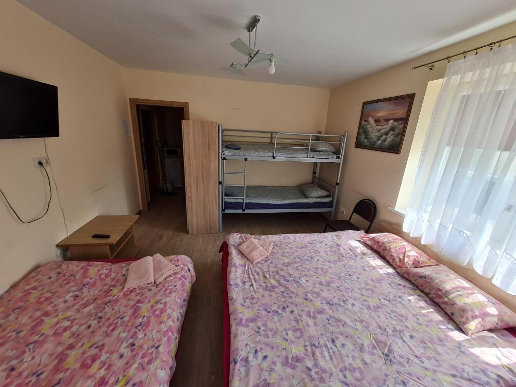 Postel nebo postele na pokoji v ubytování Little Amber Apartments