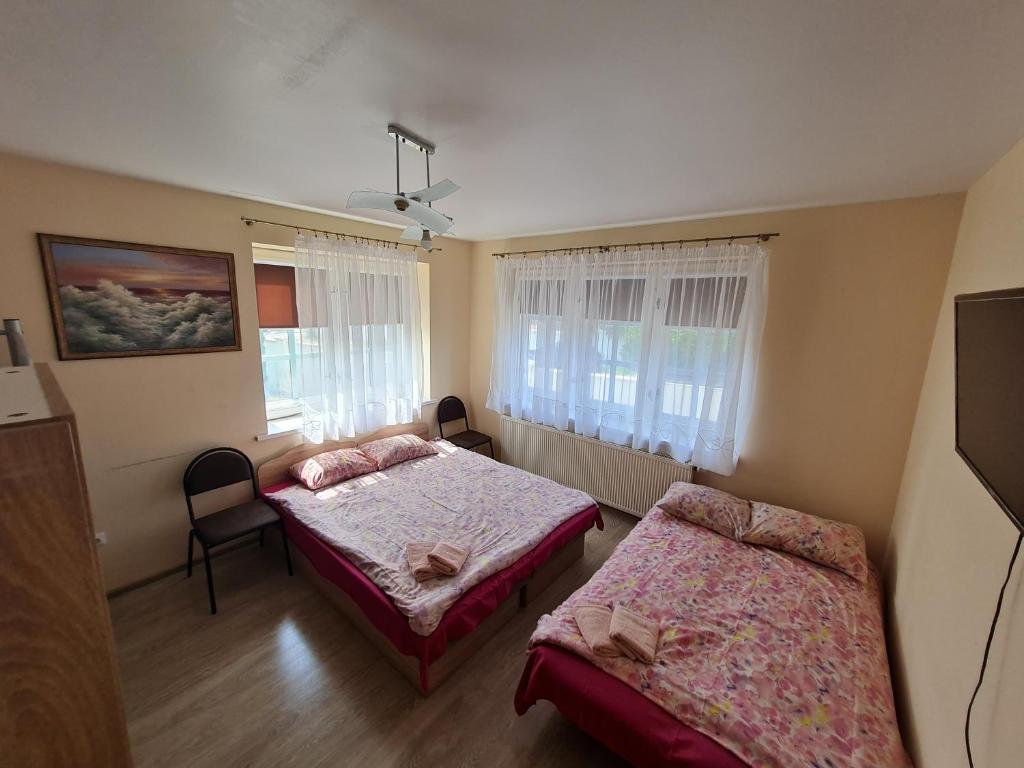 Postel nebo postele na pokoji v ubytování Little Amber Apartments