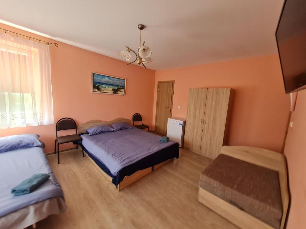 Postel nebo postele na pokoji v ubytování Little Amber Apartments