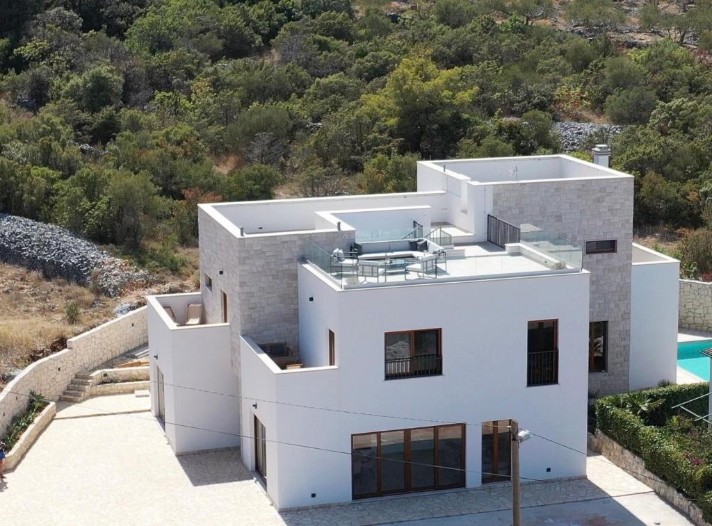 an aerial view of a white house at Villa Bora - Blue Flat Green Flat in Slatine