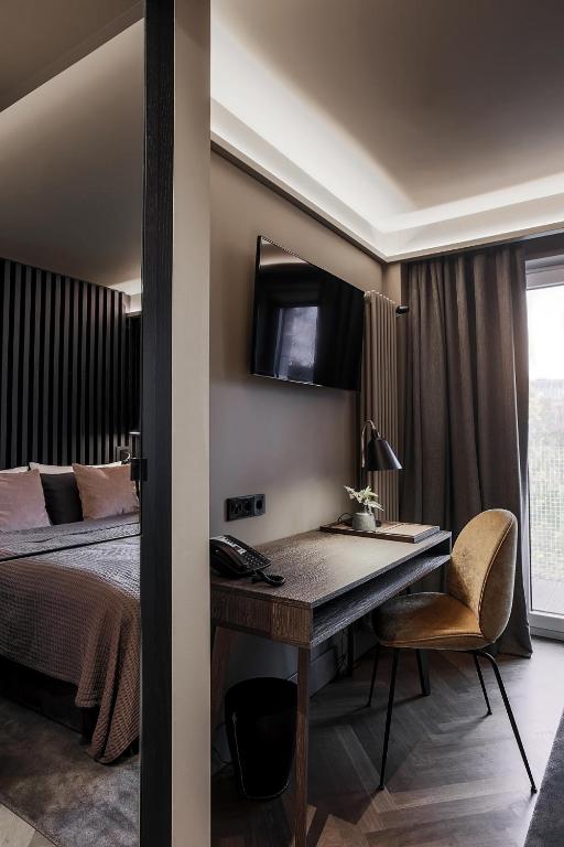 Postel nebo postele na pokoji v ubytování Mauritzhof Hotel Münster