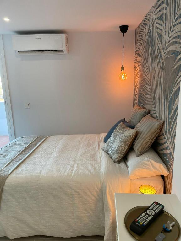 A bed or beds in a room at Apartamento Tres Banderas