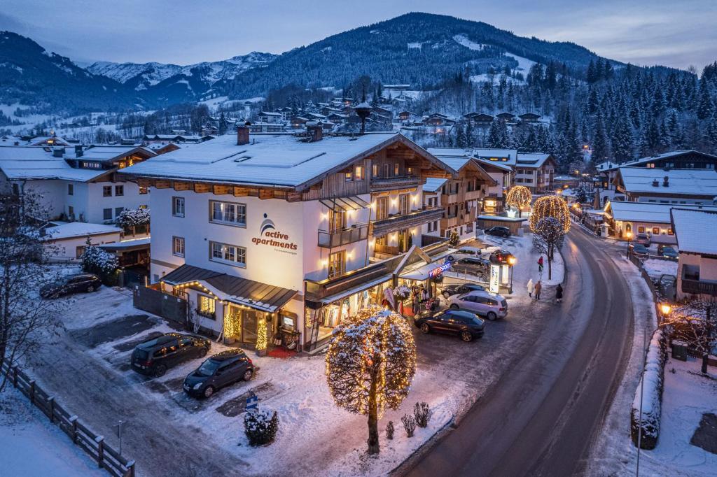 a town in the mountains with christmas lights at Active Apartments in Maria Alm am Steinernen Meer