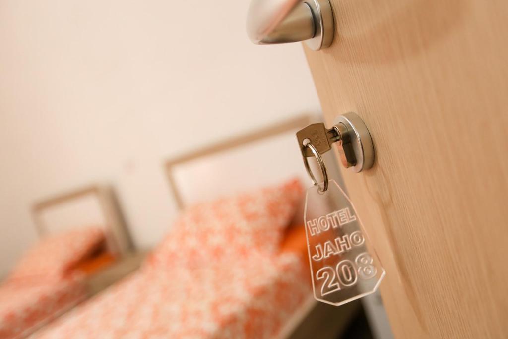 Postel nebo postele na pokoji v ubytování Hotel Jaho