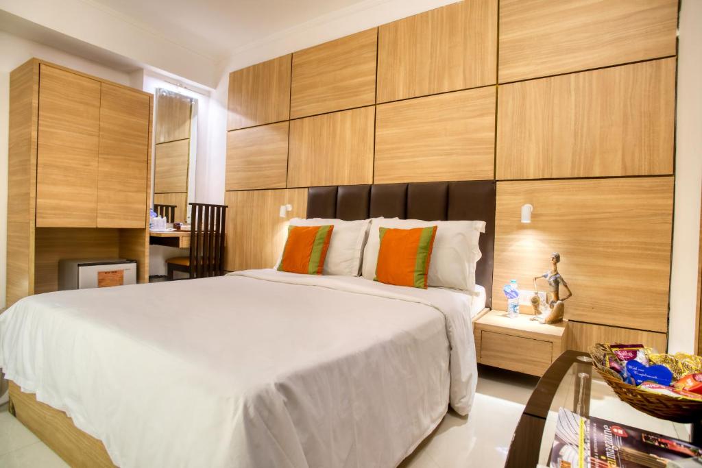 Postel nebo postele na pokoji v ubytování Roland Hotel