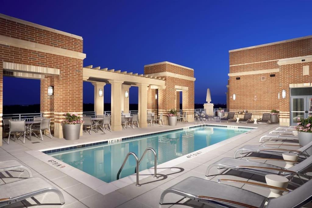 a pool on the courtyard of a hotel at Fantastic 2 BR Condo At Pentagon CIty with Pool&Gym in Arlington