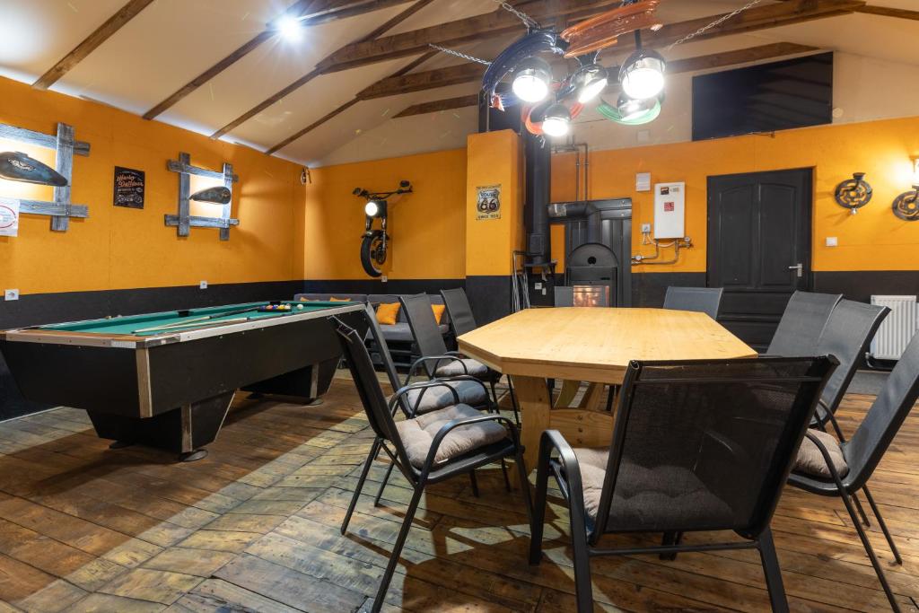 a billiard room with a table and a pool table at Keletiparty in Hajdúszoboszló