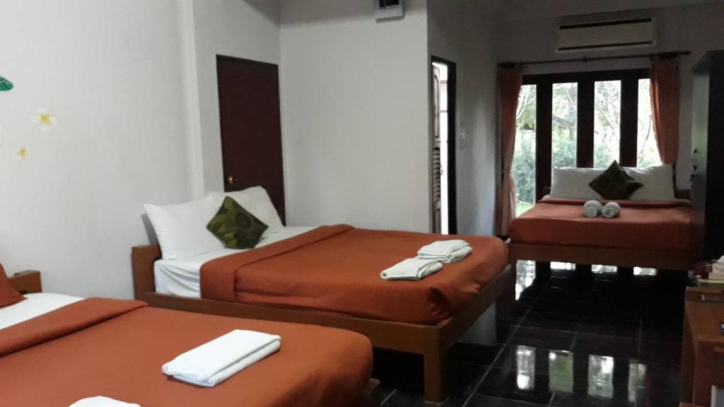 Postel nebo postele na pokoji v ubytování LUCKY PAI Resort&Hostel