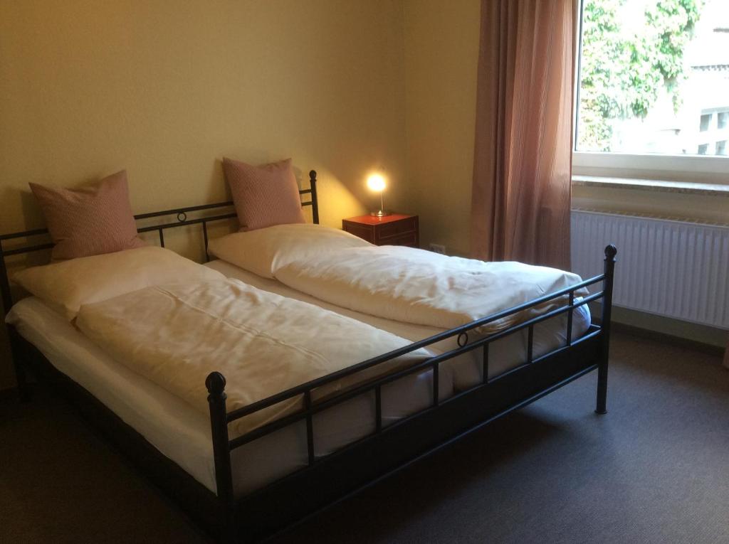 Postel nebo postele na pokoji v ubytování Hugos Haus & Berthas Haus