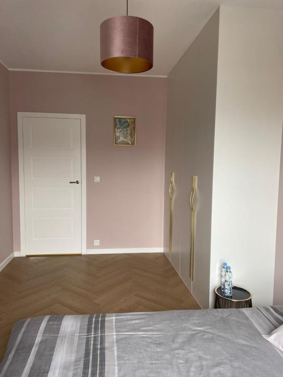 Posteľ alebo postele v izbe v ubytovaní Nowy Apartment przy Placu Szembeka