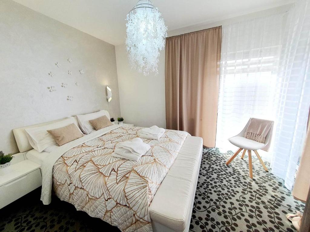 Posteľ alebo postele v izbe v ubytovaní Apartament & Spa 5 Mórz