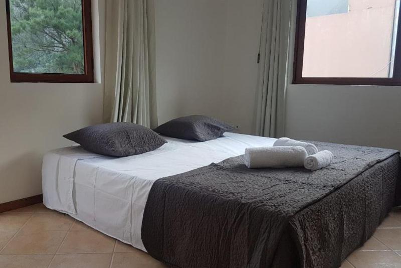 Postel nebo postele na pokoji v ubytování Residencial Lela d'Fermina