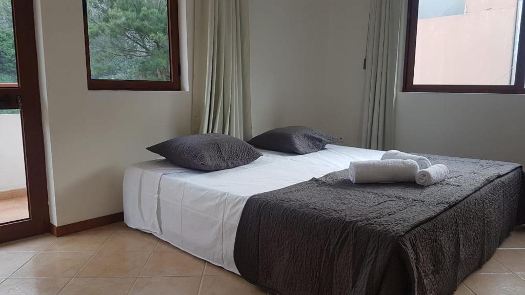 Postel nebo postele na pokoji v ubytování Residencial Lela d'Fermina