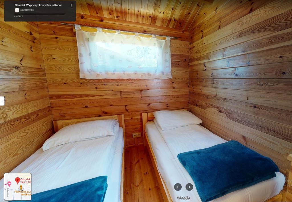Postel nebo postele na pokoji v ubytování O.W. Sęk