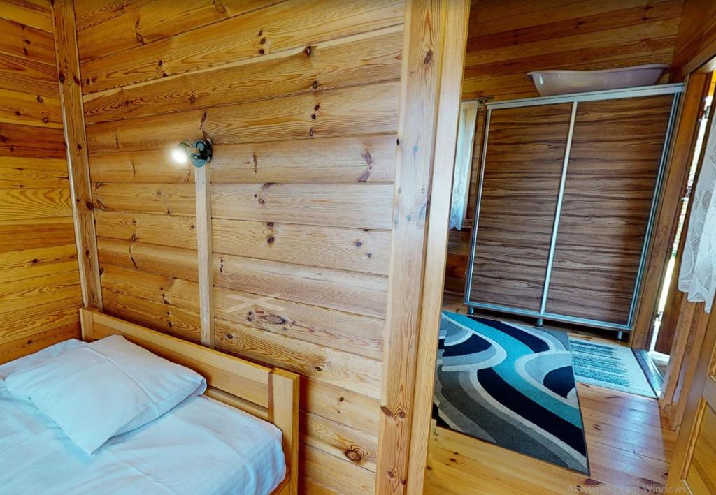 Postel nebo postele na pokoji v ubytování O.W. Sęk