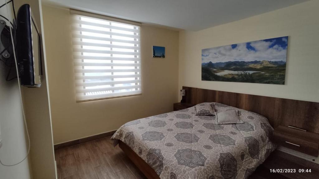 Postel nebo postele na pokoji v ubytování Apart Cayambe