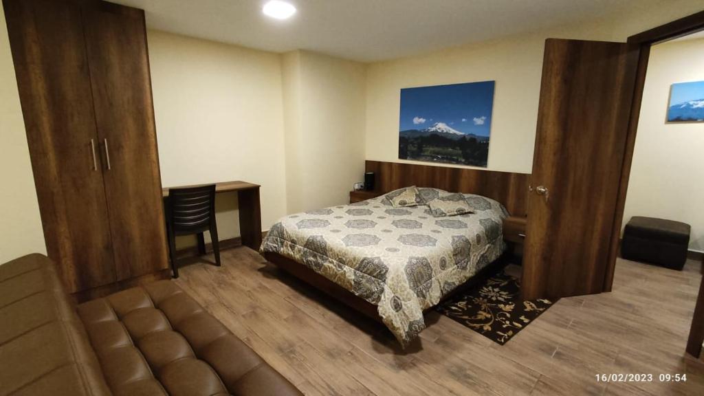 Postel nebo postele na pokoji v ubytování Apart Cayambe