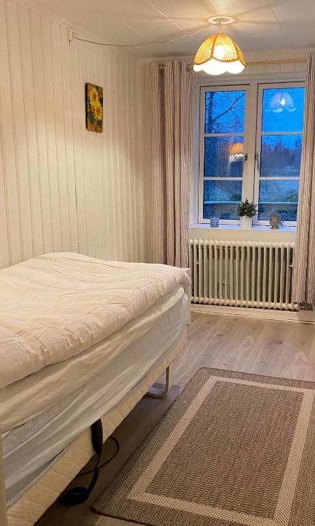 Postel nebo postele na pokoji v ubytování ELGGÅRDEN