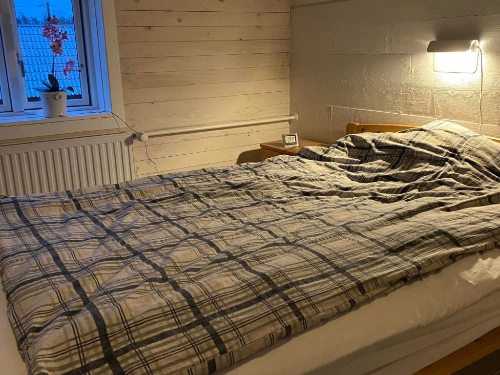 Postel nebo postele na pokoji v ubytování ELGGÅRDEN