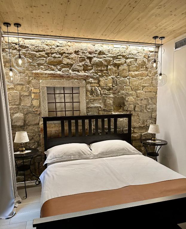 Postel nebo postele na pokoji v ubytování VENEZIANA Boutique Hotel Superior