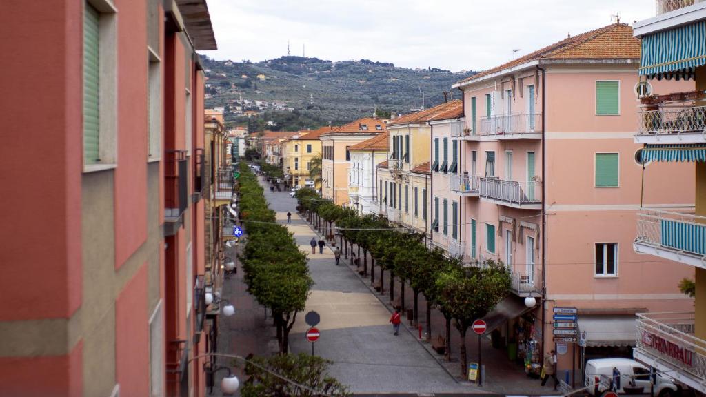 a view of a city street with buildings at Caprice Appartamenti Vacanze in Diano Marina