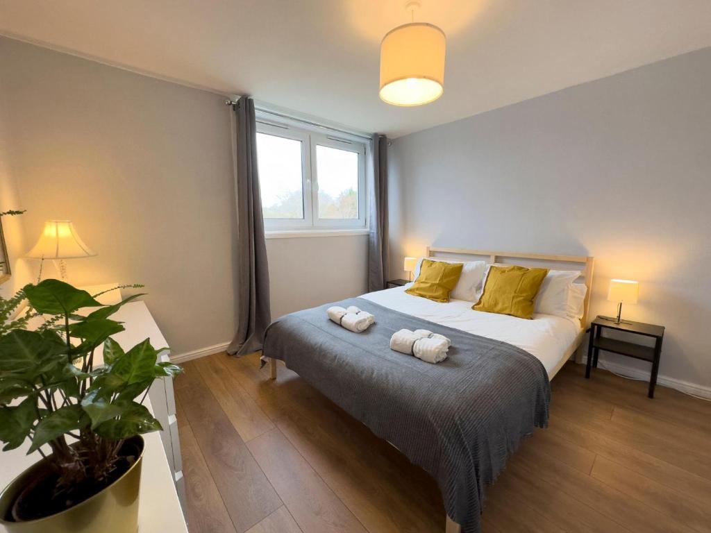 a bedroom with a bed with two pillows on it at Scandi Style Duplex Sleeps 6 in Linlithgow