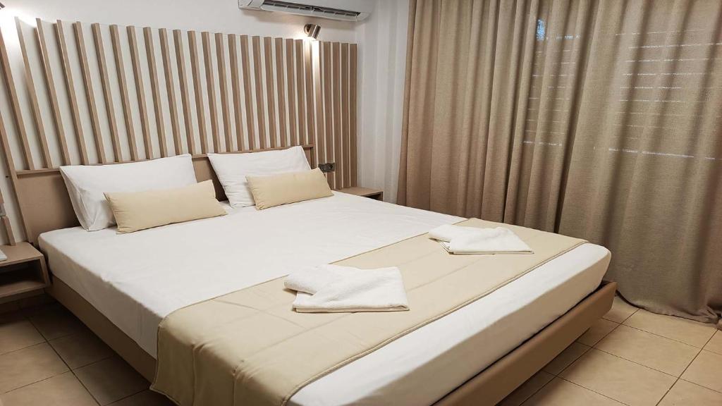 Postel nebo postele na pokoji v ubytování Anastasia Luxury Suites by Xenius Zeus in Nea Flogita