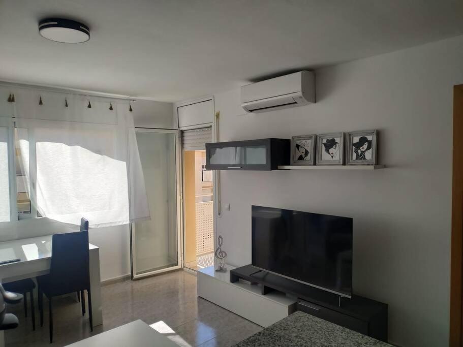 TV a/nebo společenská místnost v ubytování Playa, Port Aventura, Golf, wifi y Parking