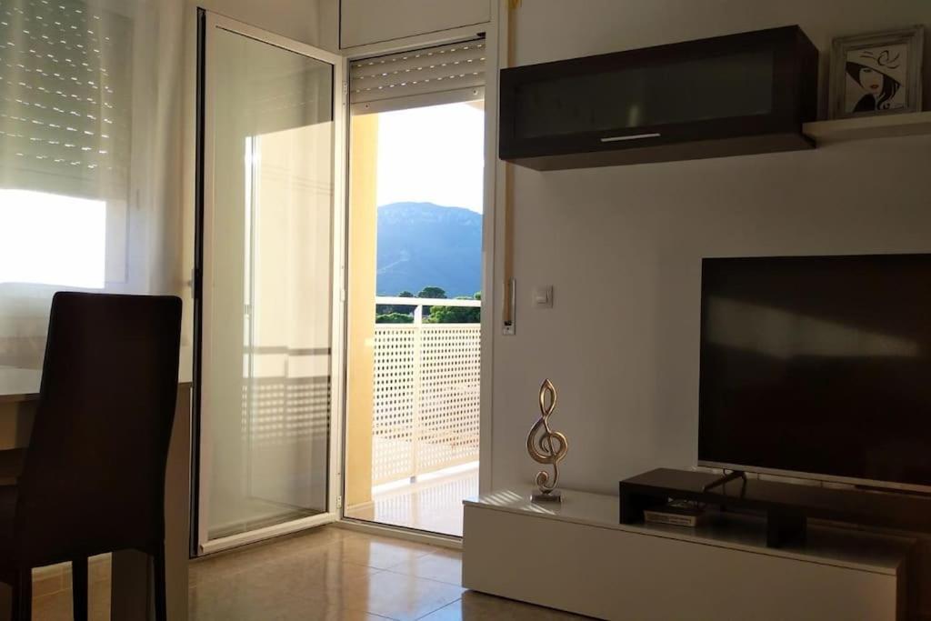 TV a/nebo společenská místnost v ubytování Playa, Port Aventura, Golf, wifi y Parking