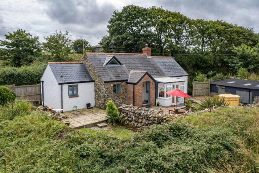 an aerial view of a house with a stone wall at Ty Pegi in Fishguard